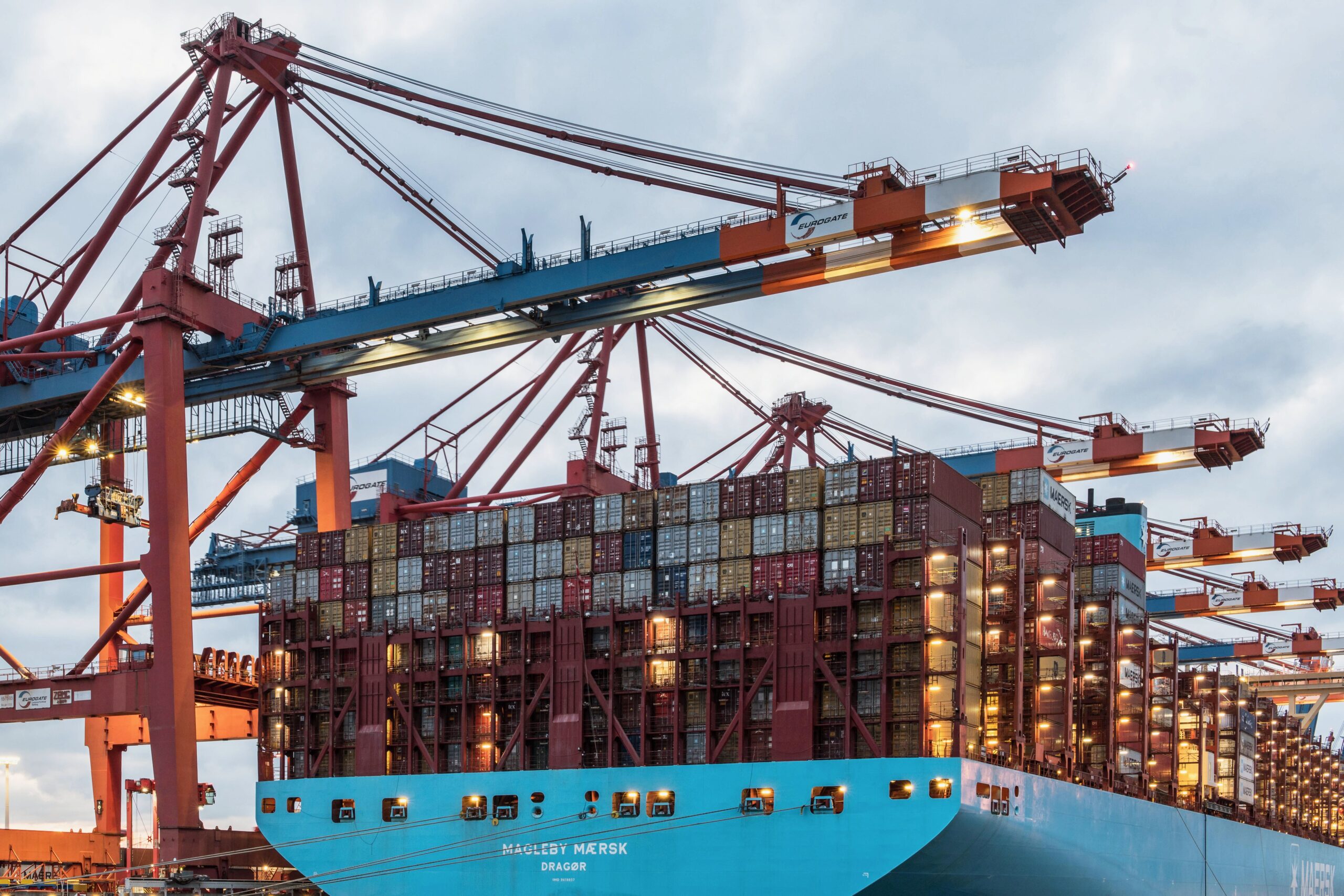 Home A cargo ship loaded with containers at Hamburg's bustling commercial dock.